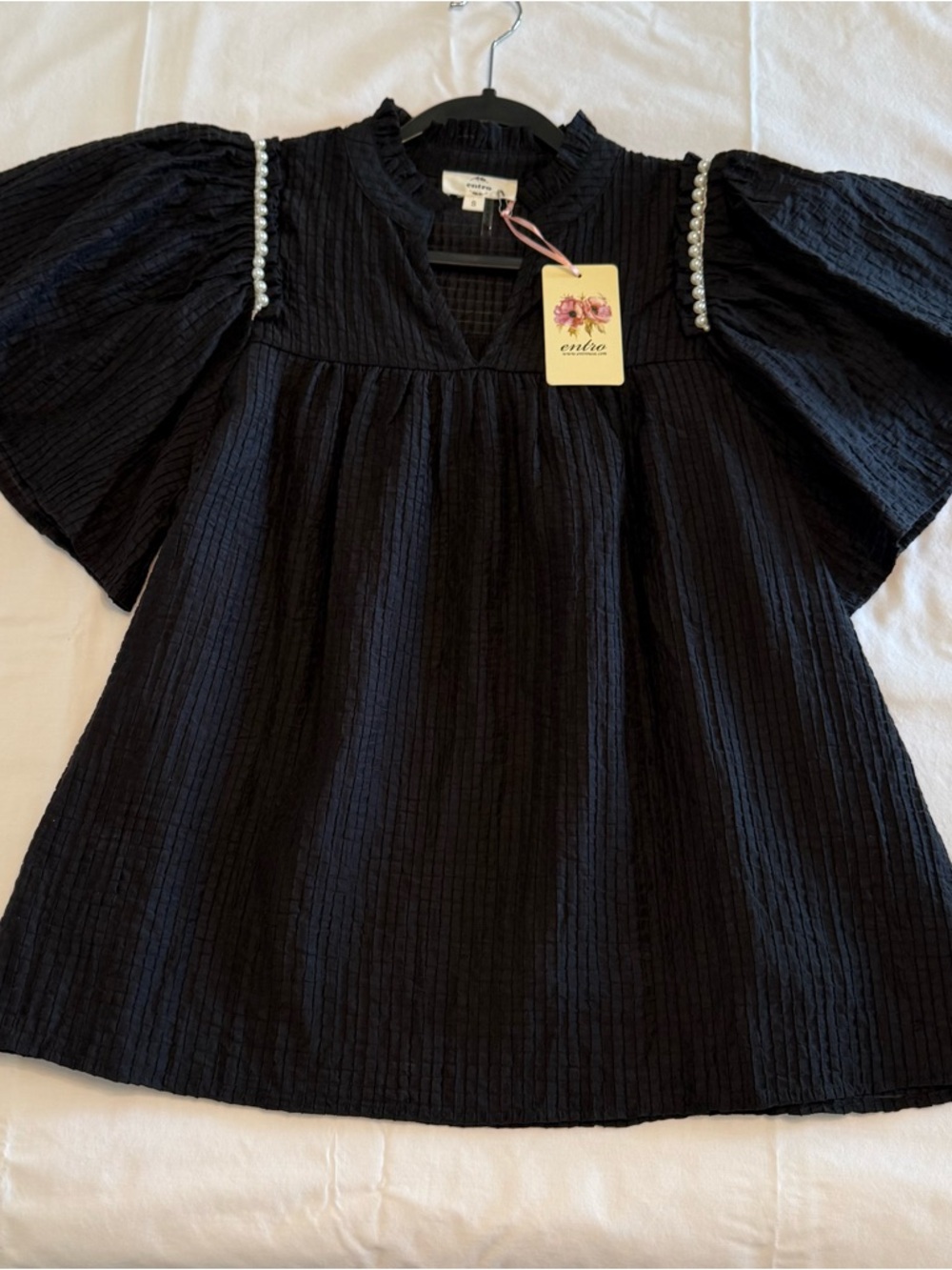 Feminine flowy top from Entro.  Black Ruffle Sleeve Blouse with Pearl Trim - Picture 4 of 14